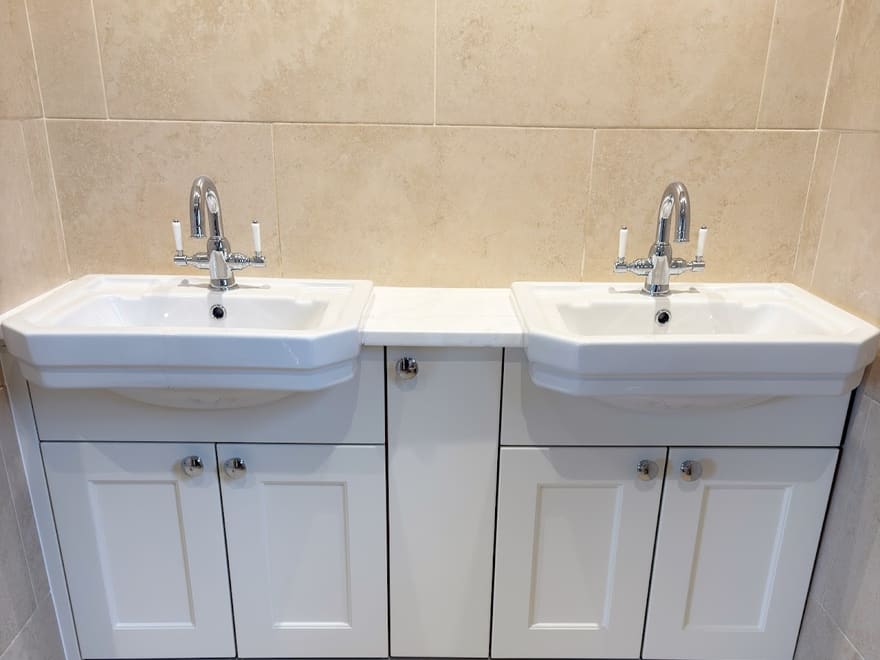 Twin basin bathroom installed by Lloyd with stone effect tiles, June 2025